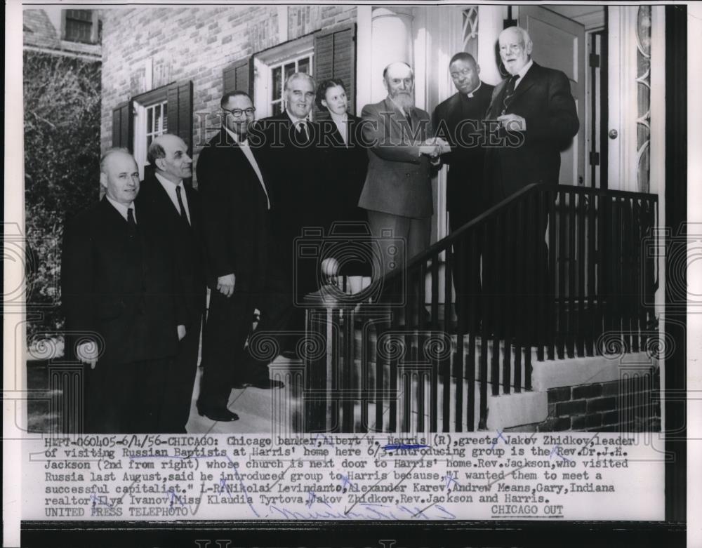 1956 Press Photo Chicago Banker Albert Harris greeted leader of Russian Baptists - Historic Images