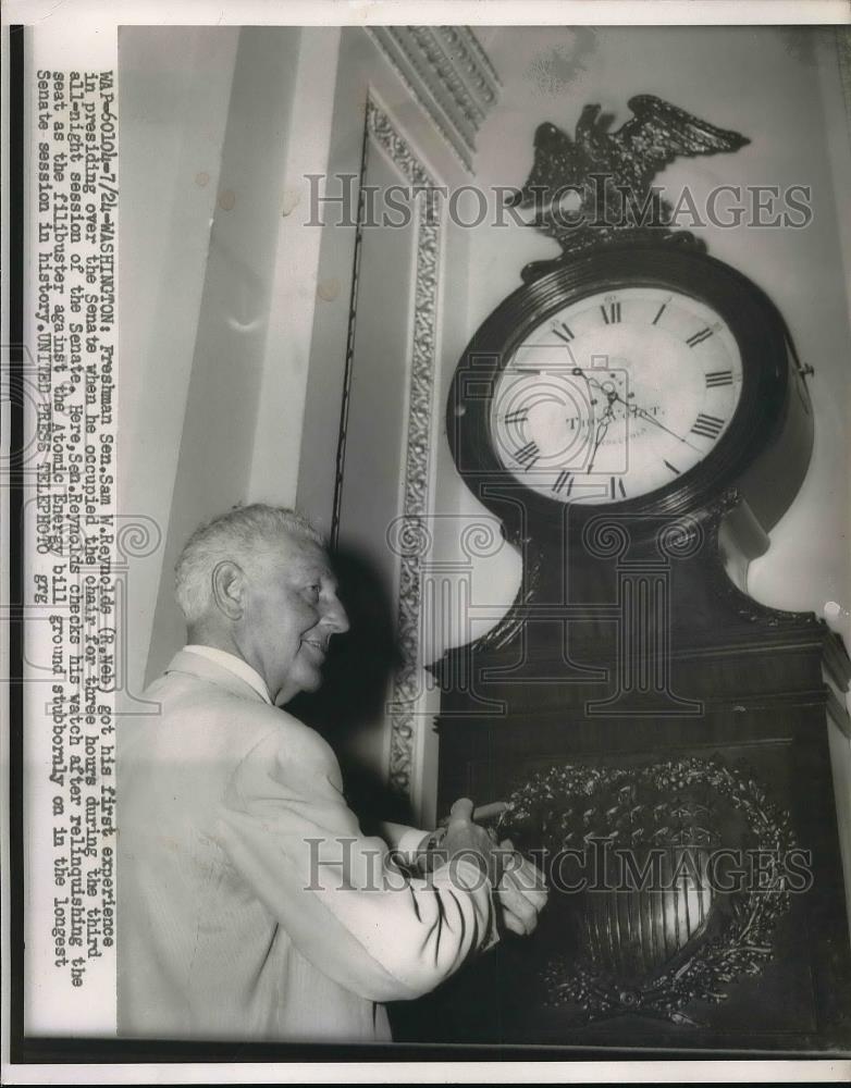 1954 Press Photo Sen. Sam W. Reynolds Checks Clock - neb09624 - Historic Images