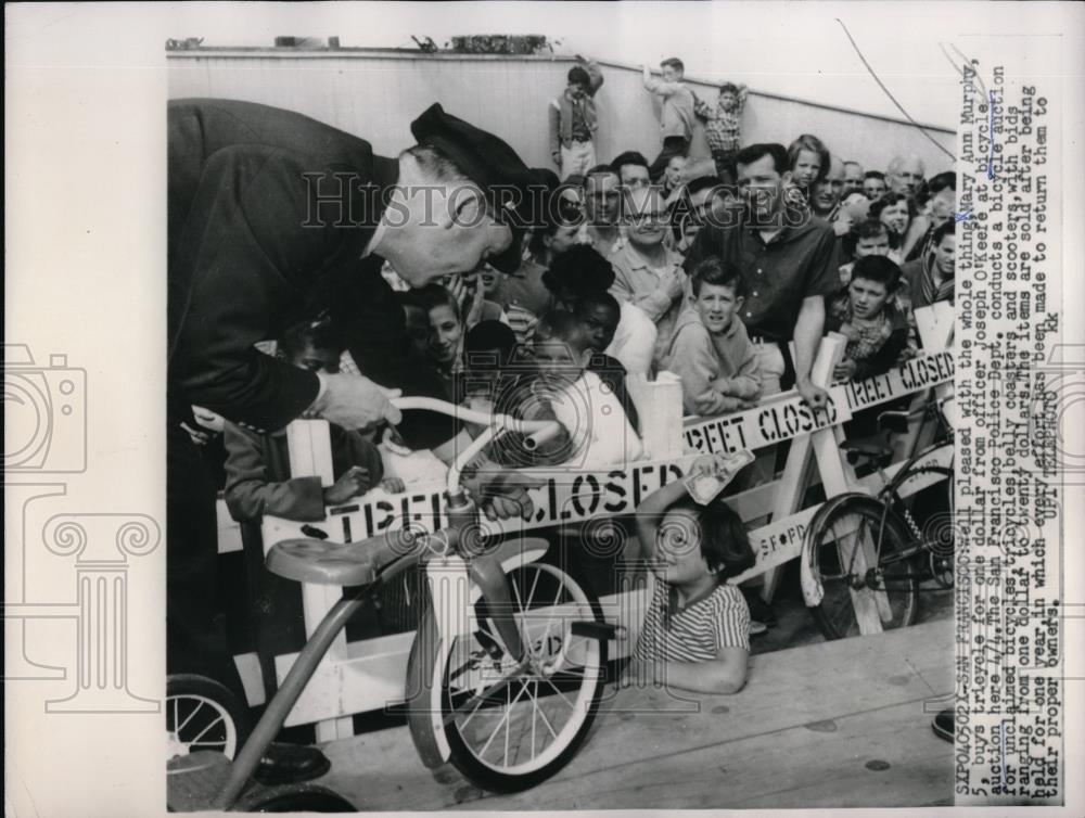 1959 Press Photo San Francisco,Ann Murphy gets bike for $1 from officer O&#39;Keefe - Historic Images