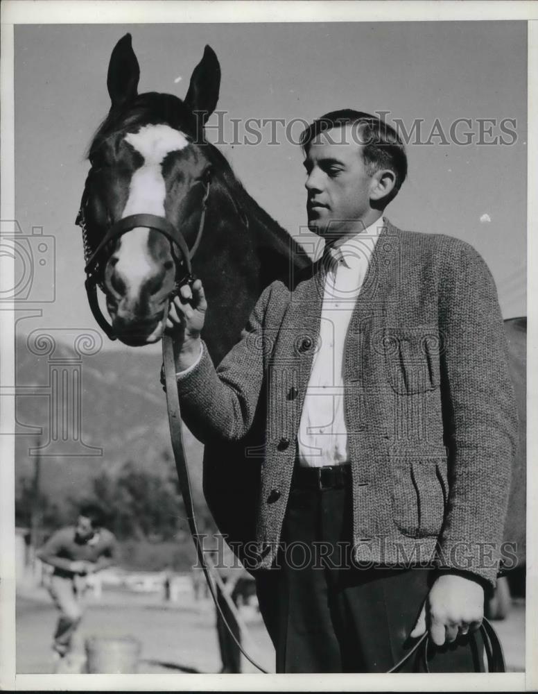 1937 Press Photo Trainer CA Raler Poses With Time Supply At Santa Anita - Historic Images