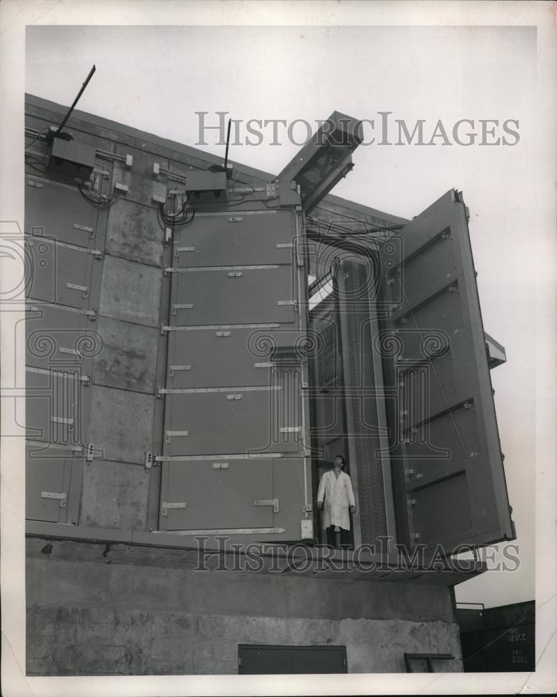 1958 Press Photo Man Standing in Huge Door of a Building - Historic Images