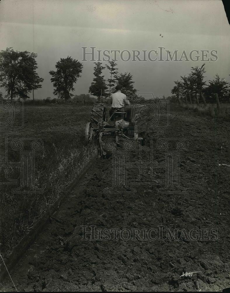 1920 Press Photo Farmer Riding Farm Tractor On Field - neb22884 - Historic Images