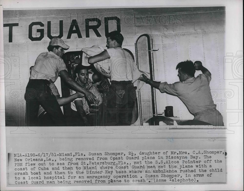 1951 Press Photo Susan Shomper Removed From Coast Guard Plane in Biscayne Bay - Historic Images