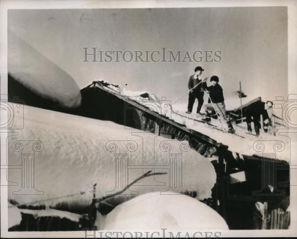 1938 Press Photo Japanese boys ski jump off a house roof - neb48724 - Historic Images