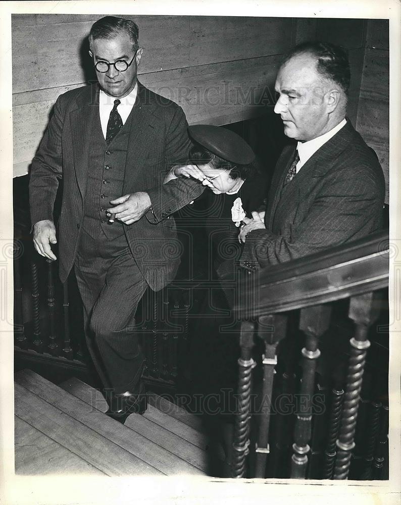 1941 Press Photo Matilda LeBoyer being escorted after she colla[sed pm the stand - Historic Images