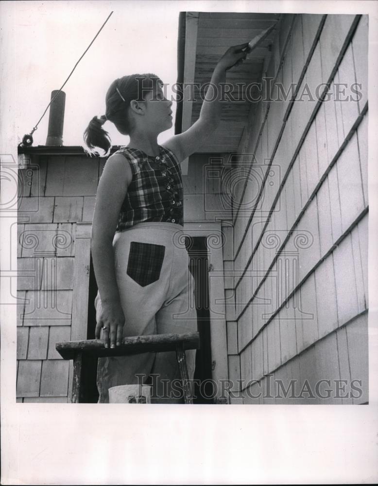 1956 Press Photo Sheryl Ehresman, 11, paints family home over Summer break - Historic Images