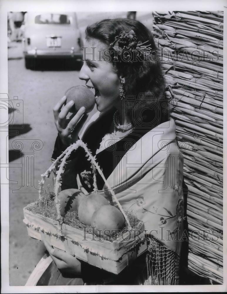 1956 Press Photo Italian Girl Eats Peach She Purchased From Market - neb52133 - Historic Images