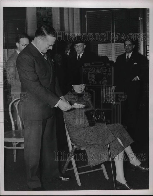 1937 Press Photo J Mahoney Shows His Wife How The Tickets Will Look - Historic Images