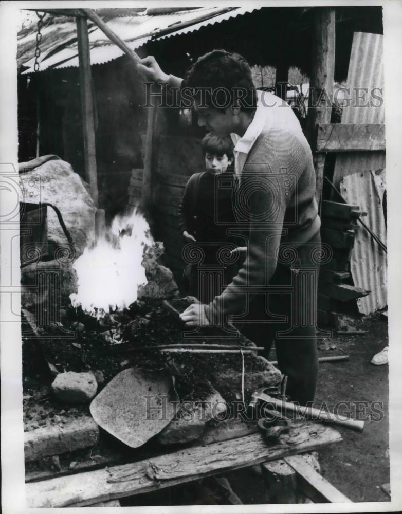 1970 Press Photo A blacksmith prepares a fire to work with metal. - neb51801 - Historic Images