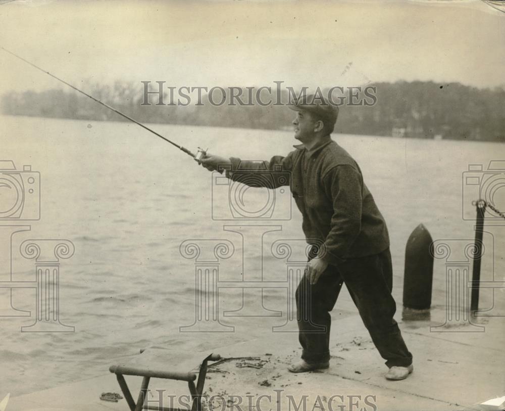 1919 Press Photo A fisherman on the banks of a river in cold weather - Historic Images