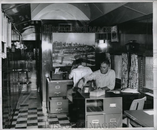 1956 Press Photo Mr MacKenzie & asst in air conditioned RR car office space - Historic Images