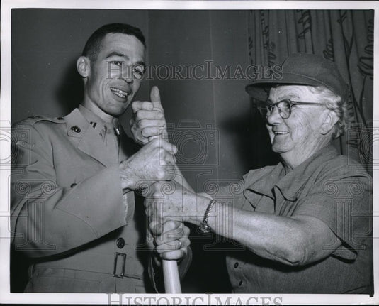 1955 Press Photo Mrs Power Does Baseball Bit With Marine Capt - Historic Images