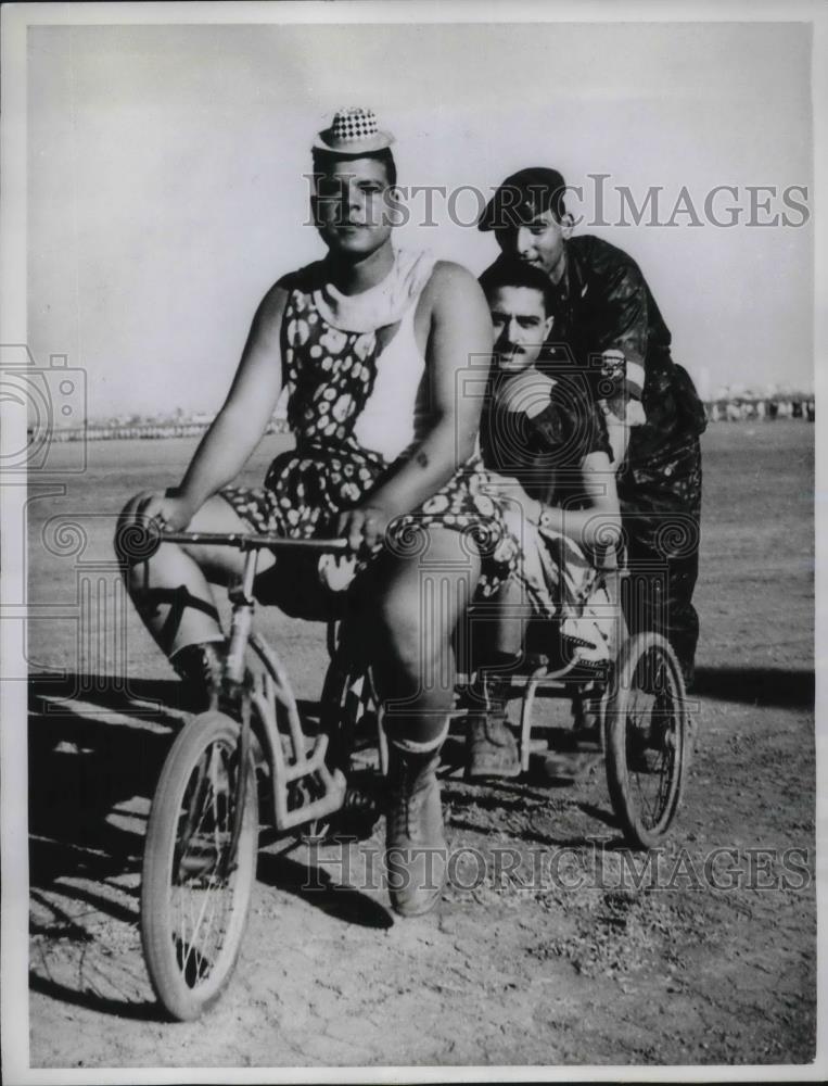 1961 Press Photo Cairo, Egypt Air Force members entertain themselves with bike - Historic Images