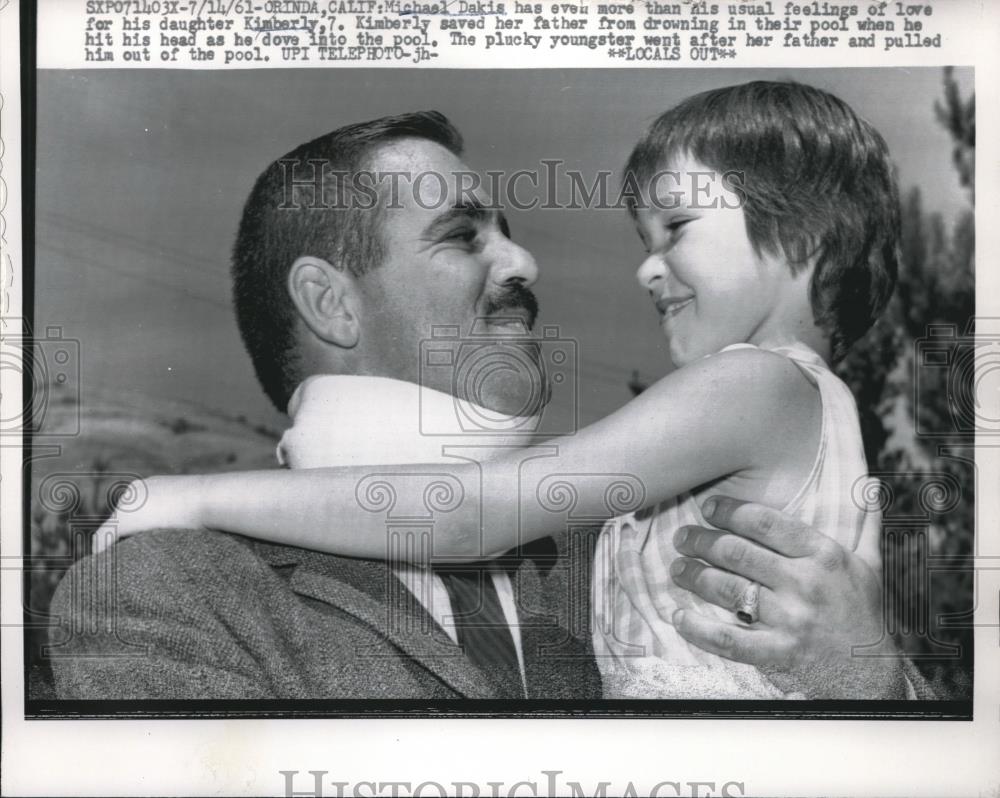 1961 Press Photo Michael Dakis was saved by his daughter from drowning in pool. - Historic Images