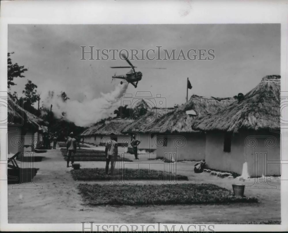 1954 Press Photo Helicopter Drops Insecticide Near Military Base In Ndolo - Historic Images