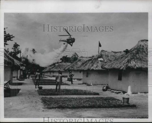 1954 Press Photo Helicopter Drops Insecticide Near Military Base In Ndolo - Historic Images