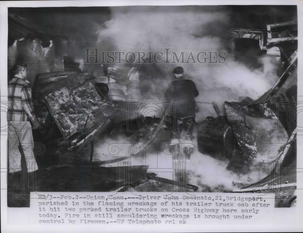 1956 Press Photo Wreckage in Flames of Trailer Truck Hitting Two Parked Trucks - Historic Images