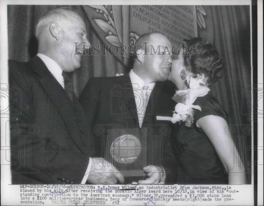 1956 Press Photo R. E. Dumas Milner, industrialist kissed byhis wife after - Historic Images