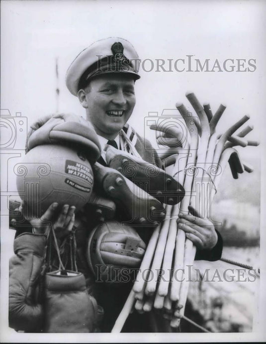 1957 Press Photo Sports Officer Ray Lander with Sports Equipment - Historic Images