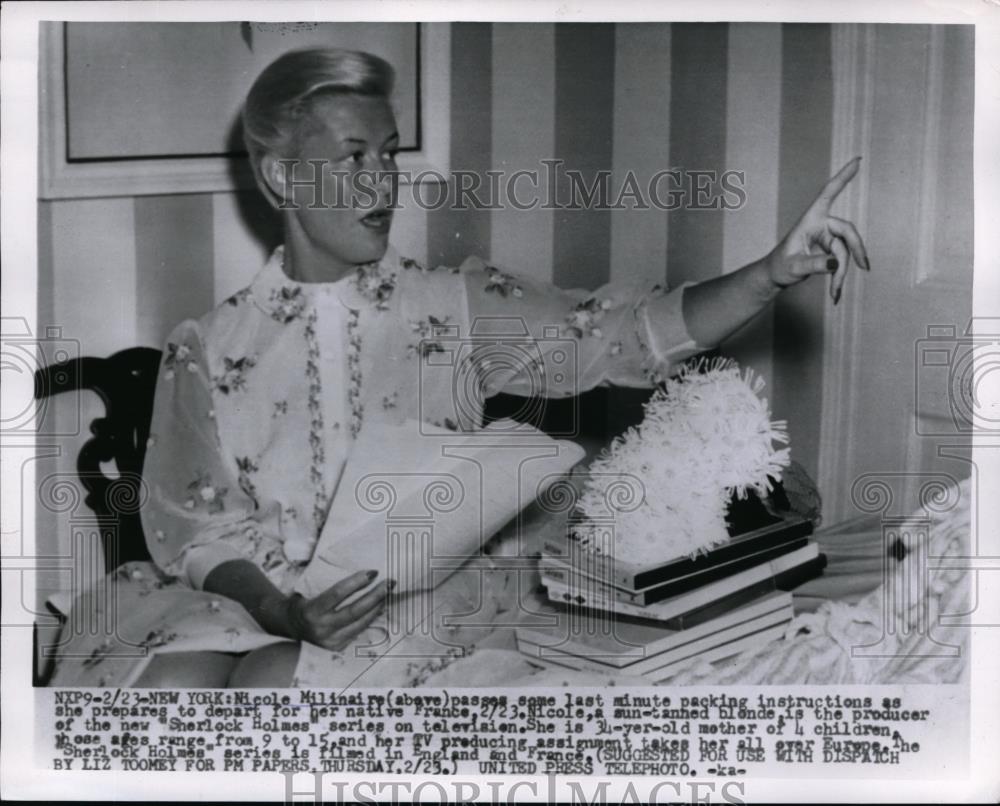 1955 Press Photo Nicole Milinaire Packing to go to France - Historic Images