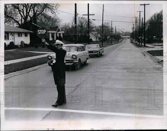 1965 Press Photo Crossing Guard Michael Smotzer Stops Traffic On W 11th St - Historic Images