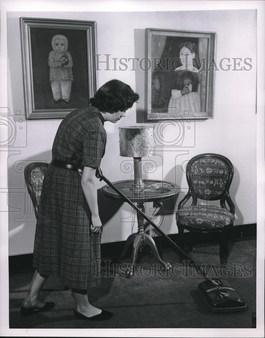 1954 Press Photo Demo of proper way to vacuum home carpets - neb66117 - Historic Images