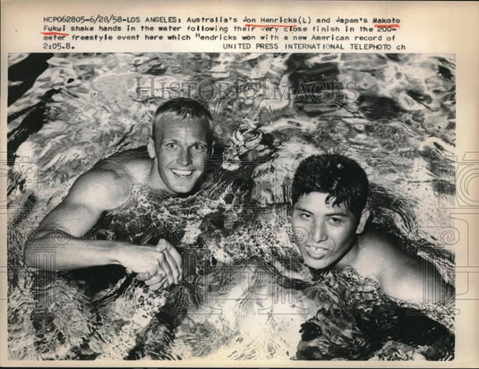 1958 Press Photo Australia's Jon Henricks, Japan's Makoto Fulio shake hands - Historic Images