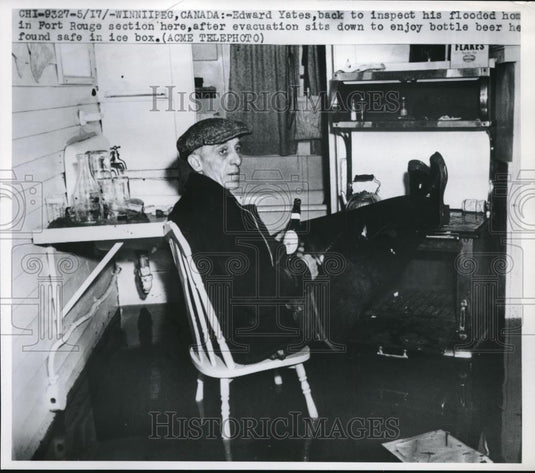 1950 Press Photo Winnipeg, Canada, Edward Yates in his flooded home - neb65938 - Historic Images