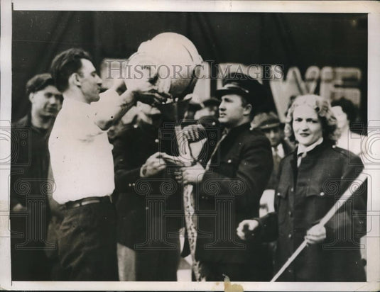 1937 Press Photo A 380 lb python being fed through a funnel tube - Historic Images