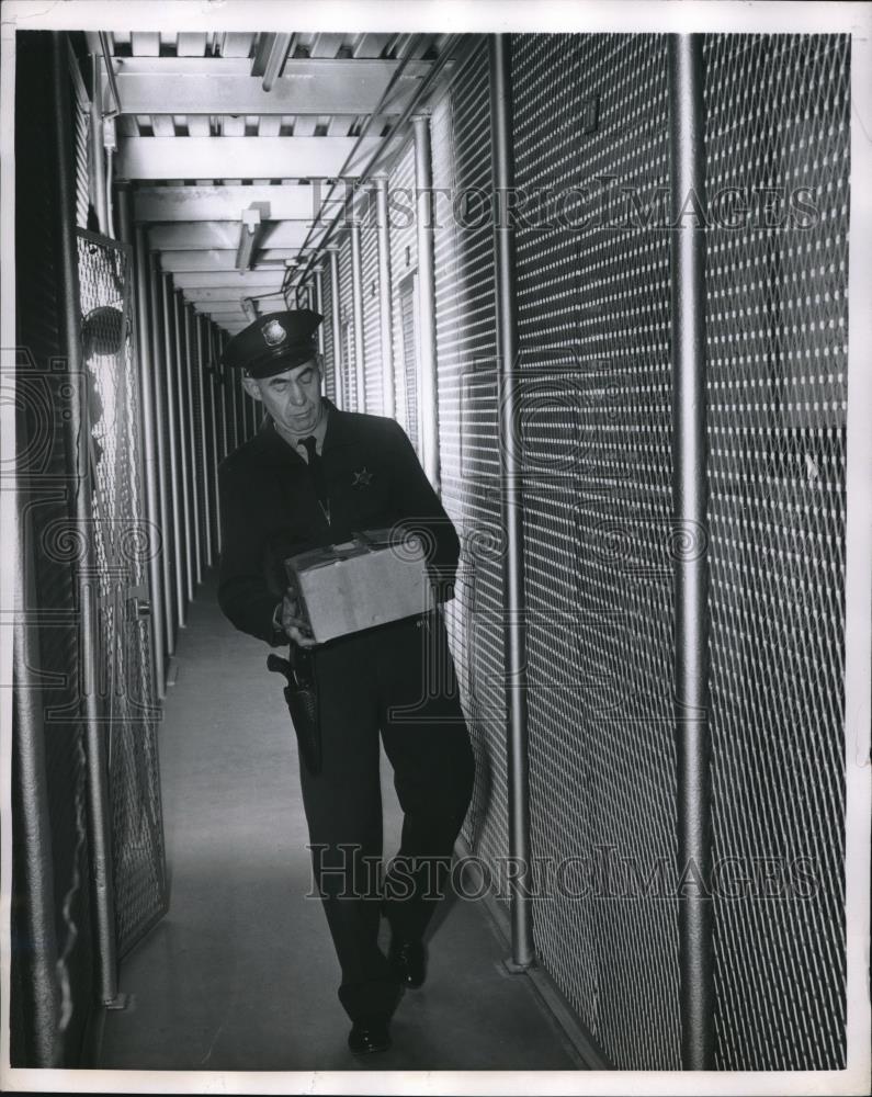 1957 Press Photo Chief Guard James Curl storing box of microfilm - Historic Images