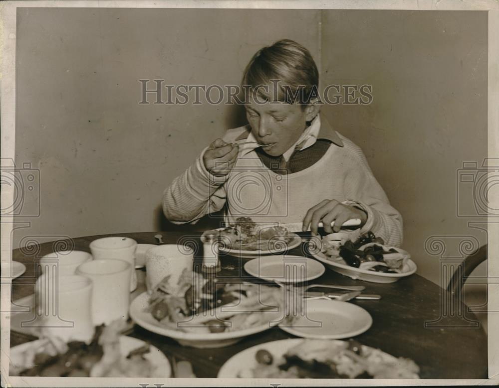 1936 Press Photo A boy eating a Christmas meal - Historic Images