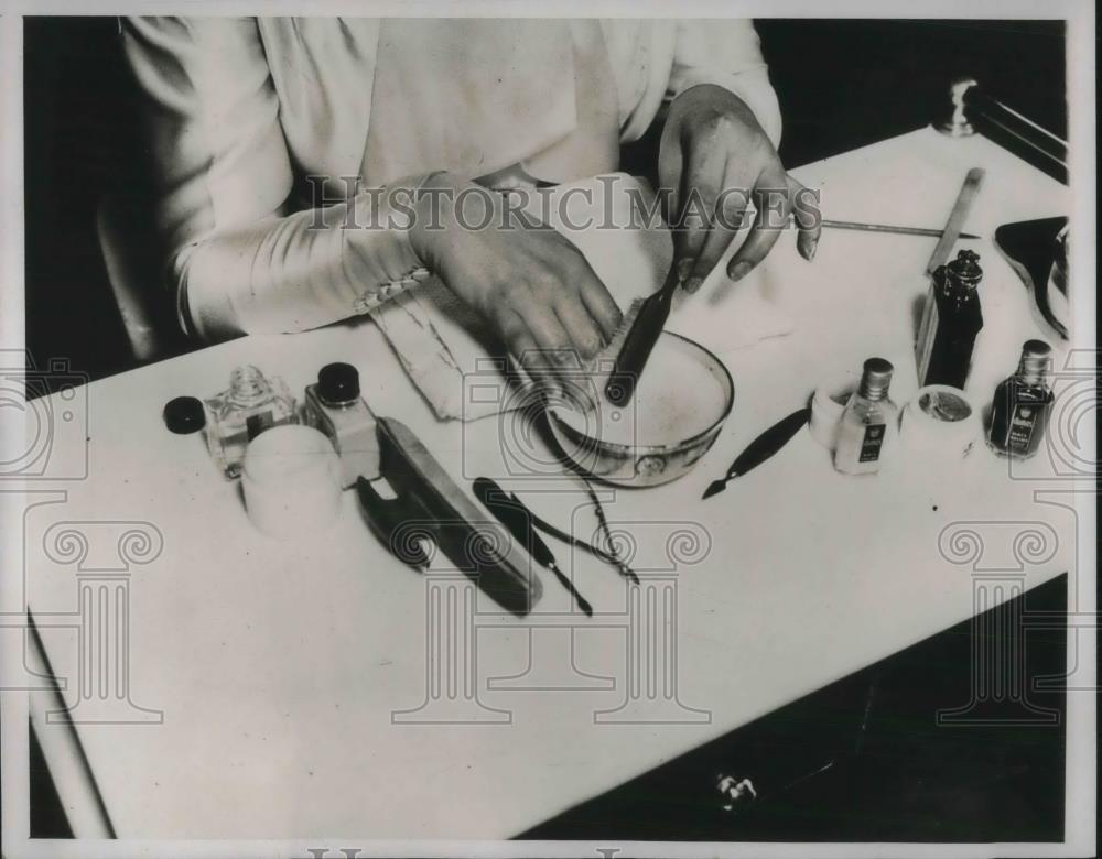 1938 Press Photo A woman getting a manicure in a salon - neb75741 - Historic Images