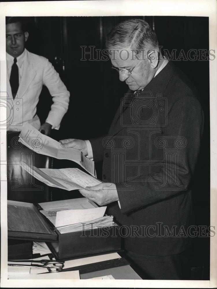 1939 Press Photo Secy. of Interior Harold Ickes looking over box of petitions - Historic Images