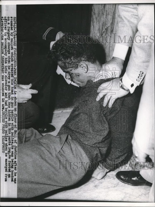 Press Photo Juan Delfin On Floor Of Hall Of Justice After Being Arrested - Historic Images