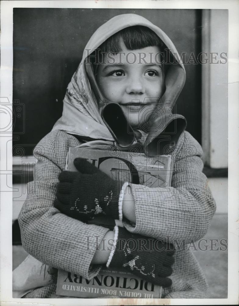 1962 Press Photo Cathy Rosamond at Age 5 with Water Bottle as Ear Muffs - Historic Images