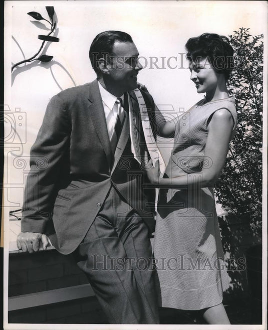 1962 Press Photo Wife Selecting Tie for Her Husband Fits His Personality - Historic Images