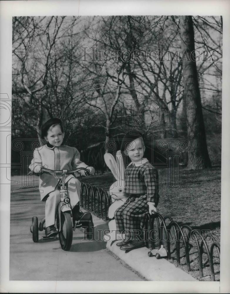 1949 Press Photo Two youngsters in new fashions with a tricycle - Historic Images