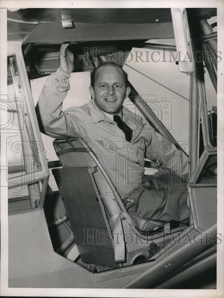 1938 Press Photo Pilot Emiil Krope in his new plane as he waved to the crowd. - Historic Images