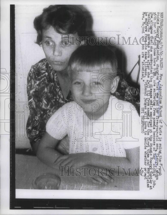 1961 Press Photo Paris, Mrs Jacqueline Majoni & son Pierre suing French AEC - Historic Images