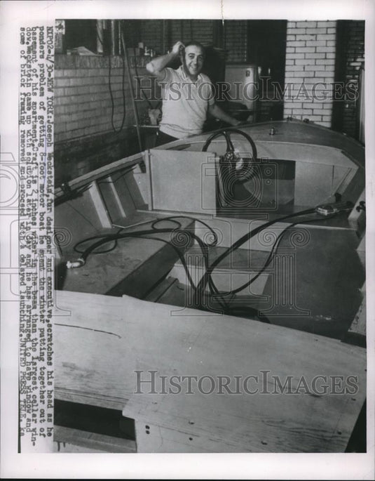 1955 Press Photo New York's Joseph Weckstein Ponders Boat-In-Basement Problem - Historic Images