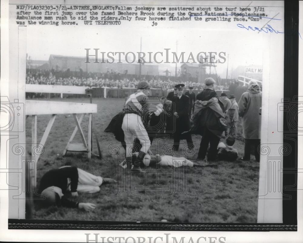 1959 Press Photo fallen jockeys at first jump in Grand National Steeplchase, UK - Historic Images