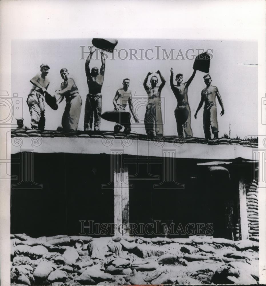 1958 Press Photo Marines Tearing Up Sand Bags That were in Bunkers Korea - Historic Images