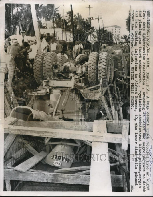 1956 Press Photo A Huge Cement Truck Toppled Into An Eight Foot Deep Excavation - Historic Images
