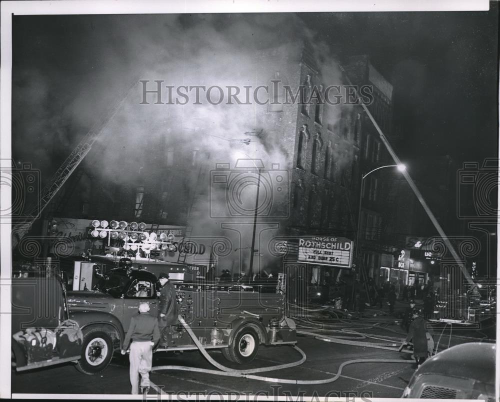 1957 Press Photo General view as firemen put out blaze at Liquor store in Chi - Historic Images