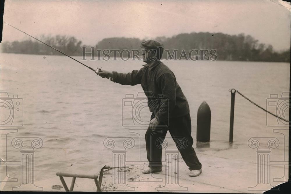1919 Press Photo Fisherman at the dock of a river, casting his reel - neb86629 - Historic Images