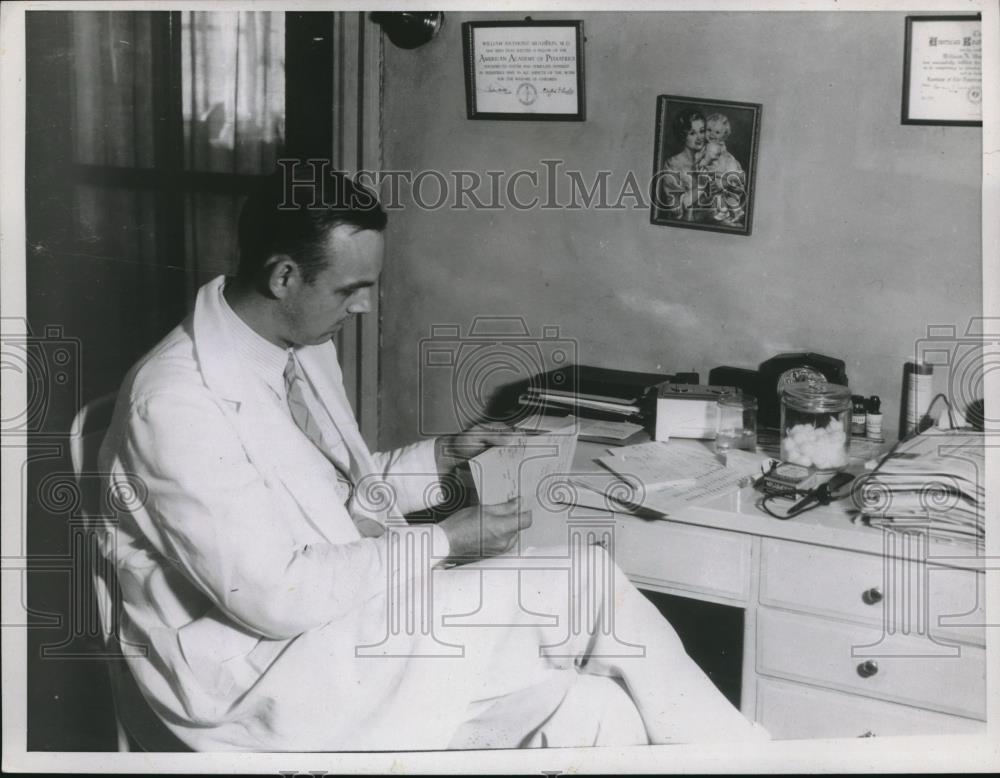 1937 Press Photo Doctor Sitting In His Office - Historic Images