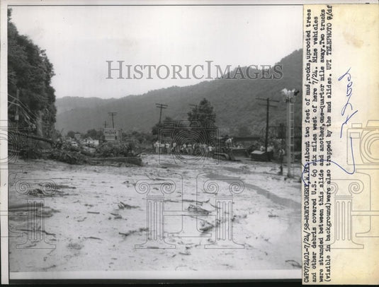 1958 Press Photo Mud, rocks, uprooted trees, cover U. S. 60, Montgomery, WV - Historic Images