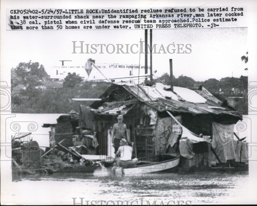 1957 Press Photo man refuses to be evacuated from shack in flood, Little Rock AR - Historic Images