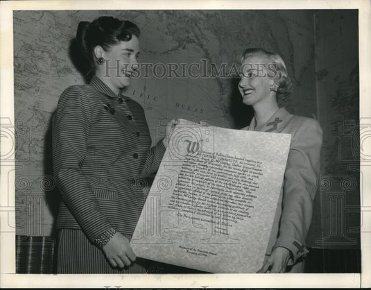 1954 Press Photo Two women holding a document at a museum - Historic Images