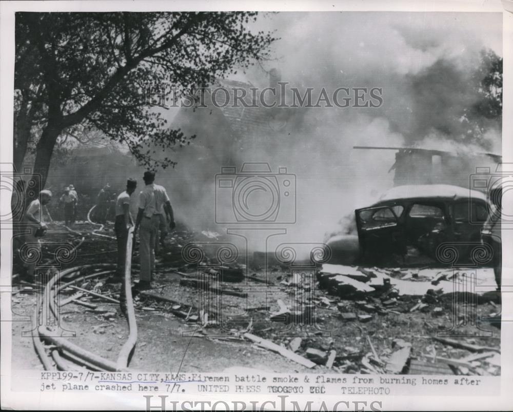 1934 Press Photo Firemen putting out flames from plane crash in Kansas CIty KS - Historic Images